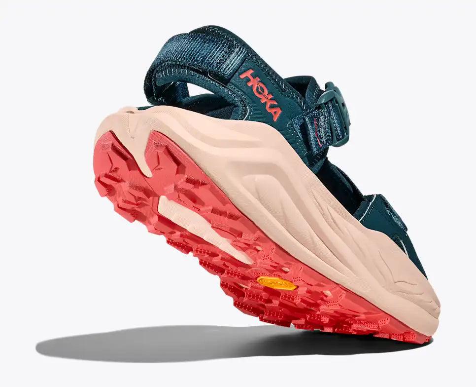 Blue sandal with red sole on a white background