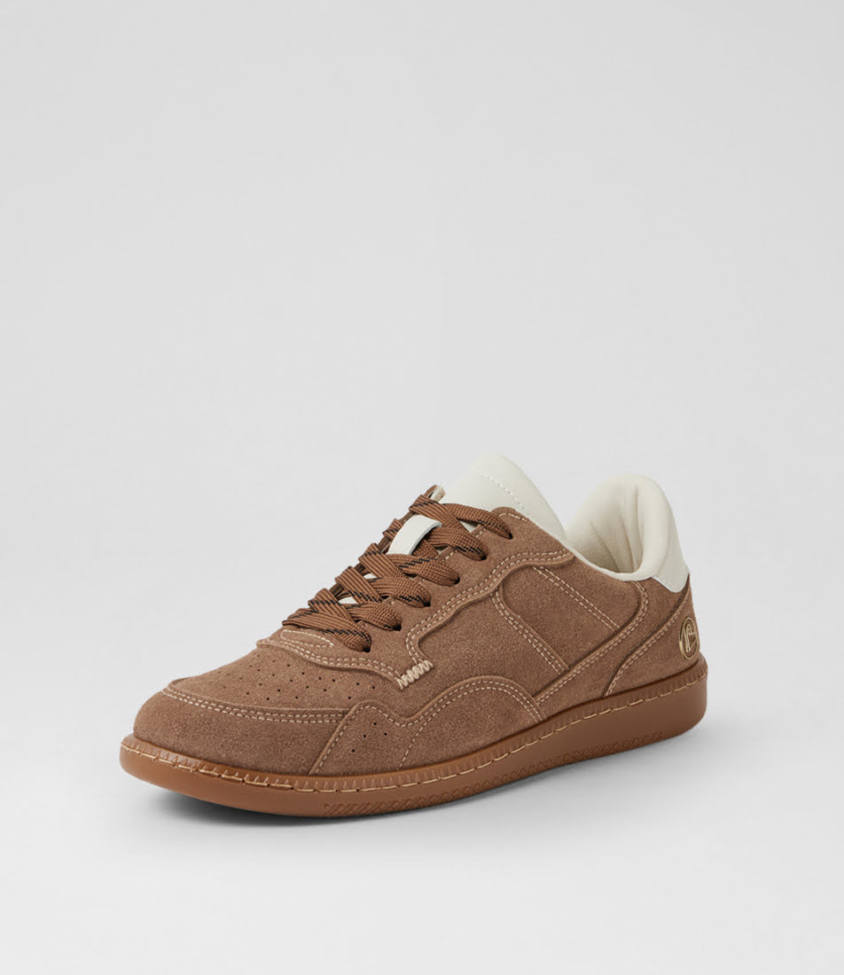 A low-top suede sneaker in brown with a white interior lining and a gum sole, shown from a three-quarters angle on a light gray background.