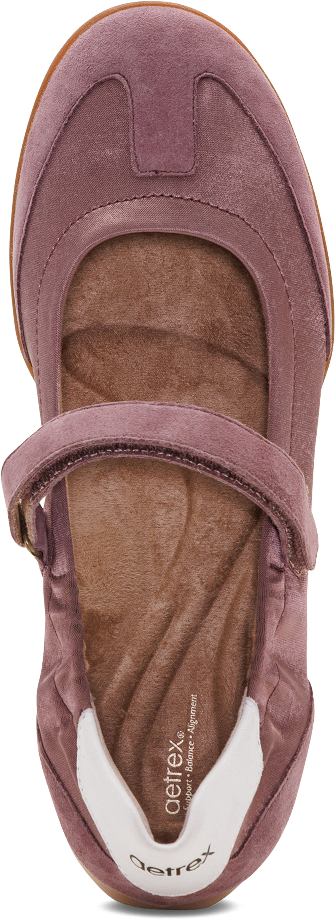 A single ballet flat shoe in dusty mauve suede with a brown contoured footbed and a white heel insert. The brand name &
