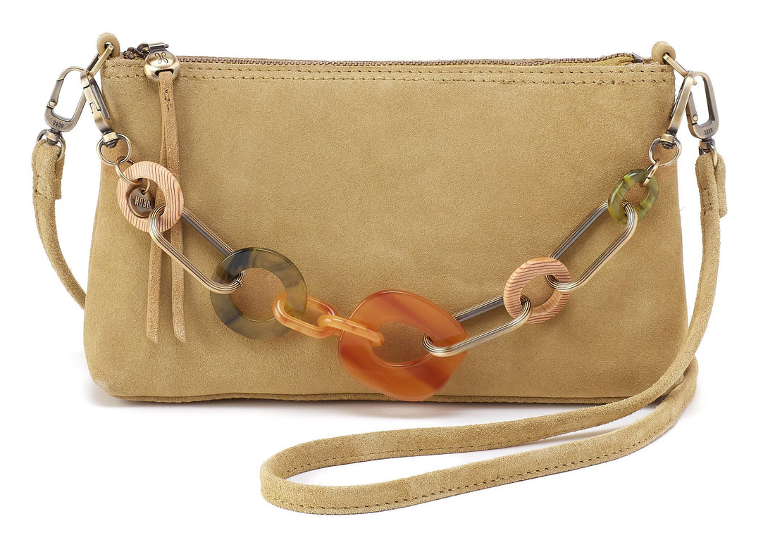 Beige handbag with a colorful chain strap on a white background