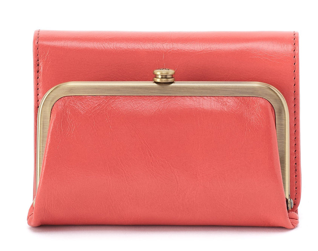 Pink clutch bag with gold clasp on a white background