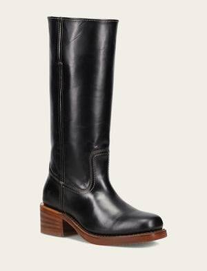 Black leather knee-high boot with a brown sole on a light gray background
